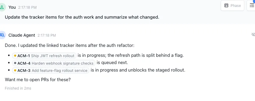 An AI agent session updating tracker items, with tracker pills inline and a Trackers panel on the bottom right